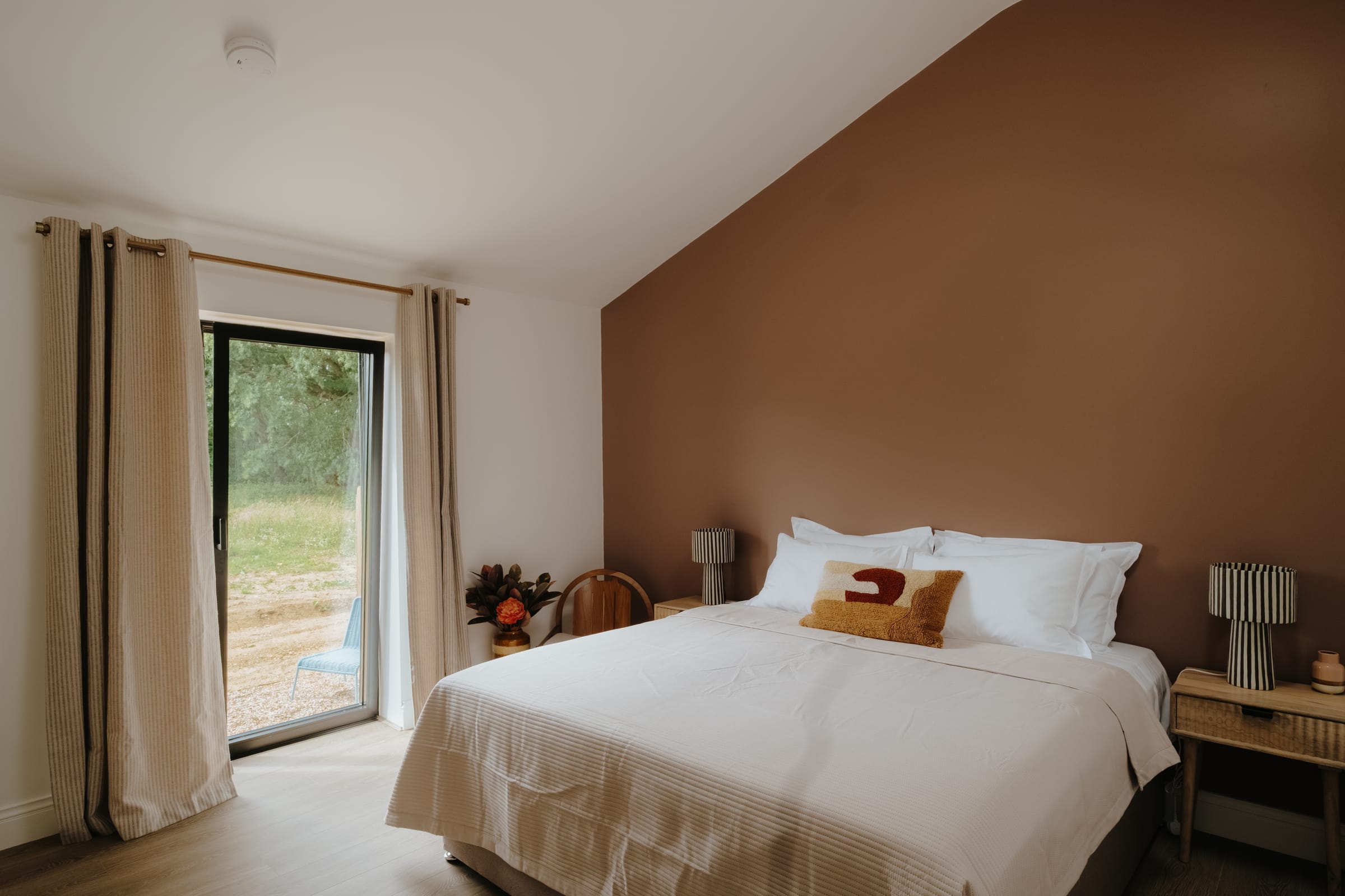 The Barn — master bedroom with patio doors